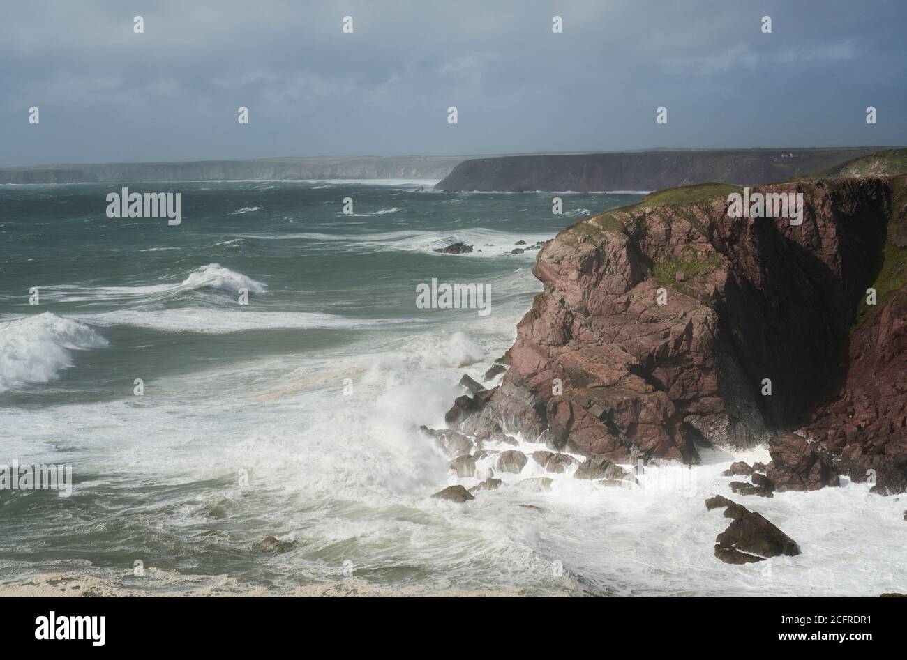 Storm pounding the cliffs near St. Ann's Head, entrance to Milford Haven, Pembrokeshire, Wales Stock Photo