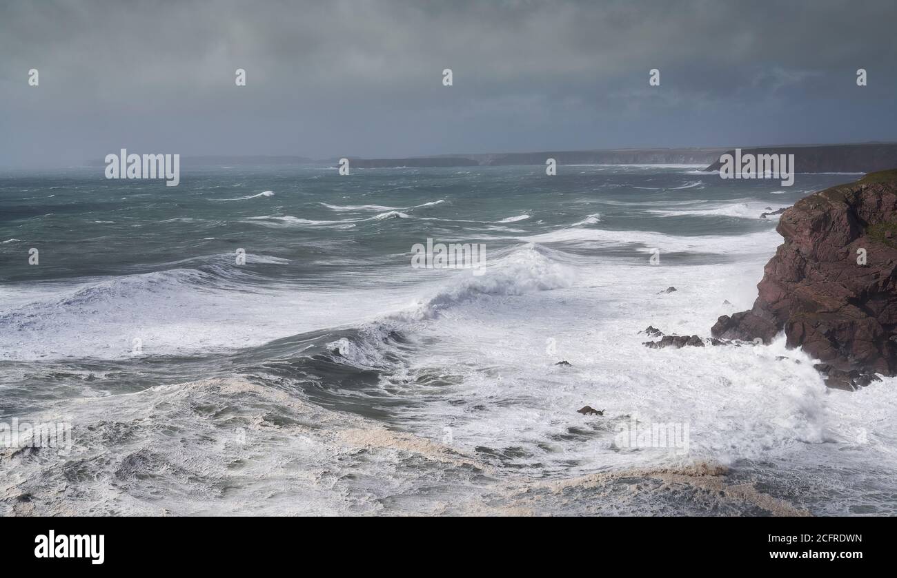 Storm pounding the cliffs near St. Ann's Head, entrance to Milford Haven, Pembrokeshire, Wales Stock Photo