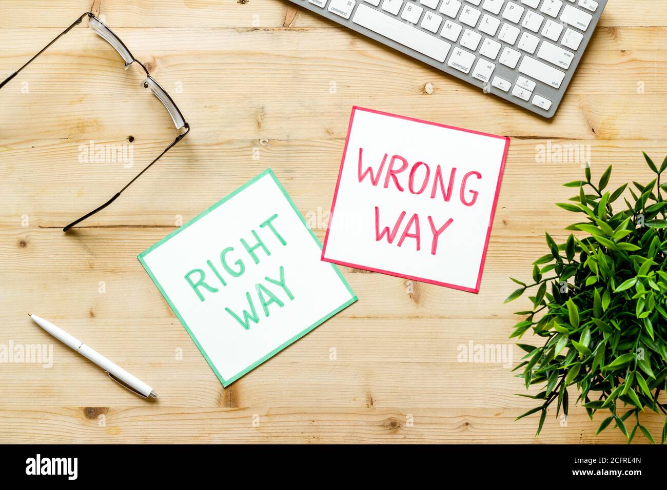 Problem solving. Right and wrong way icons on work desk from above ...
