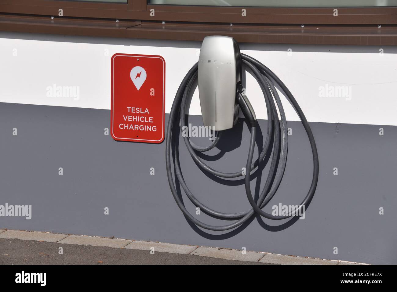 06 September 2020, Rhineland-Palatinate, Prüm: A charging station for TESLA Elektrofahrzeuge, manufacturer of electric vehicles, at the building of its subsidiary Tesla Grohmann Automation. Photo: Horst Galuschka/dpa Stock Photo