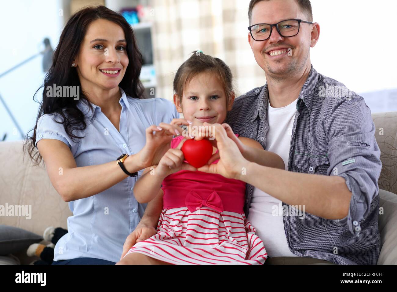 Mom dad and child with love symbol Stock Photo - Alamy