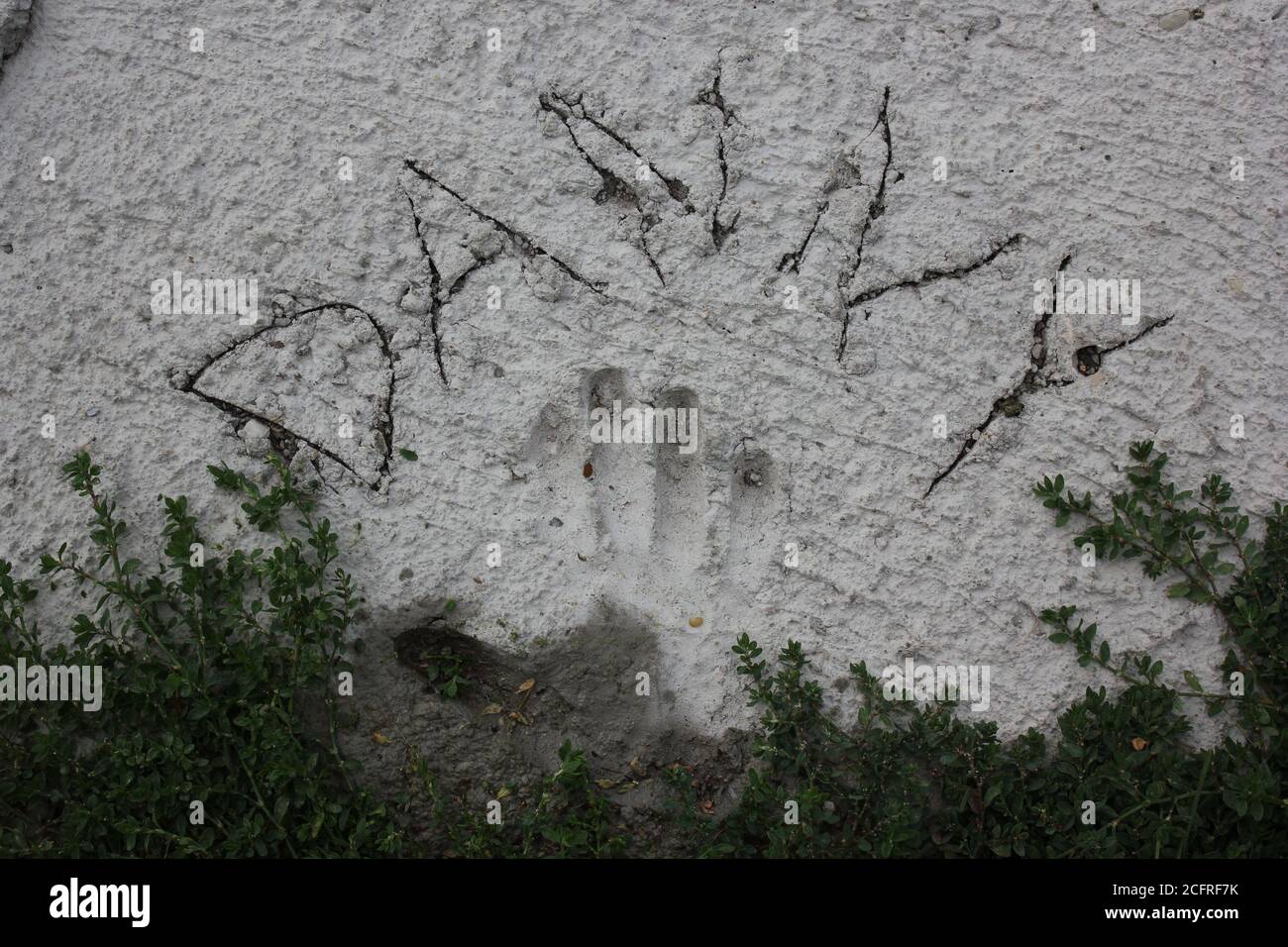 The name Danny written in concrete with a hand print at Lake Opeka Park in Des Plaines, Illinois. Stock Photo