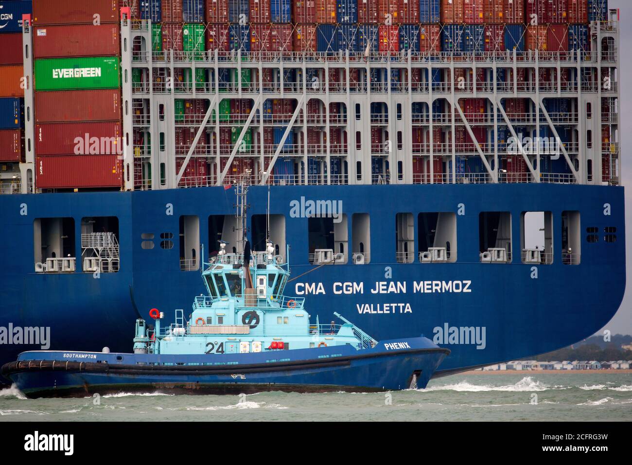 CMA CGM Jean Mermoz,Tug,Phenix,towing,The Solent,Southampton,Container  Port, container,box,close,up,Cowes,Isle of Wight,England,UK Stock Photo -  Alamy