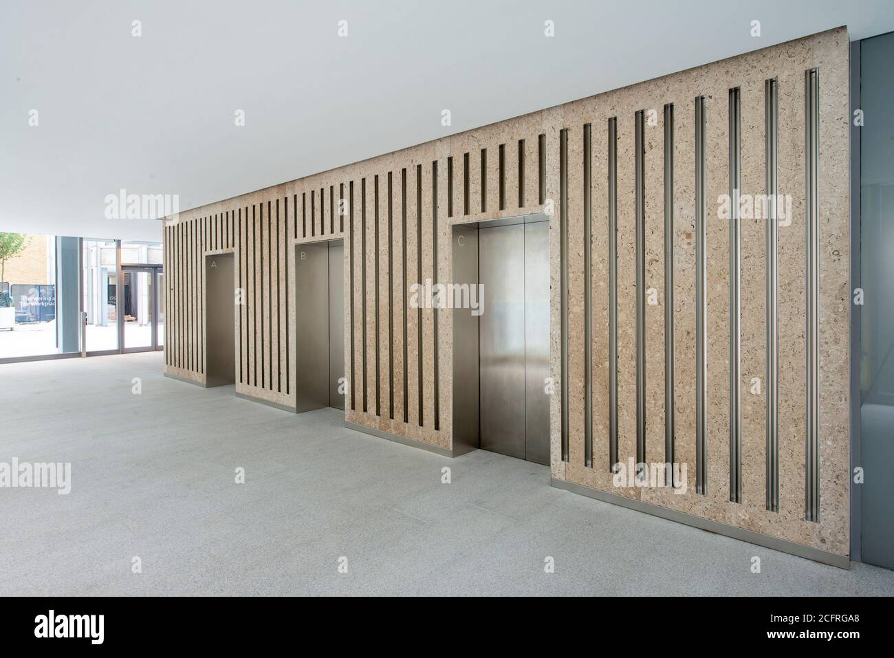 Reception area in the main tower lift lobby after refurbishment by dsdha. The Economist Building, London, United Kingdom. Architect: Alison & Peter Sm Stock Photo