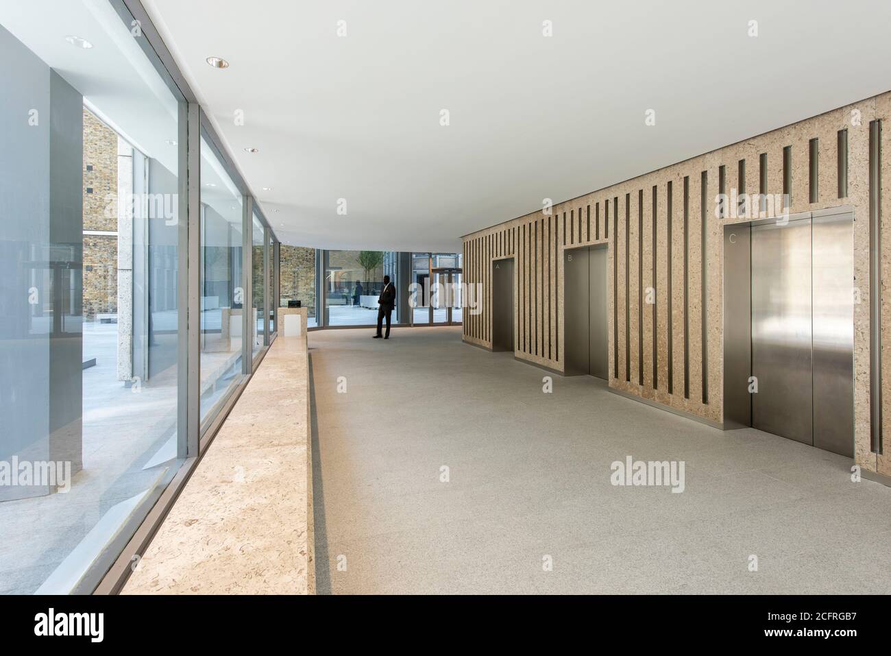 Reception area in the main tower lift lobby, looking to plaza and residential tower after refurbishment by dsdha. The Economist Building, London, Unit Stock Photo