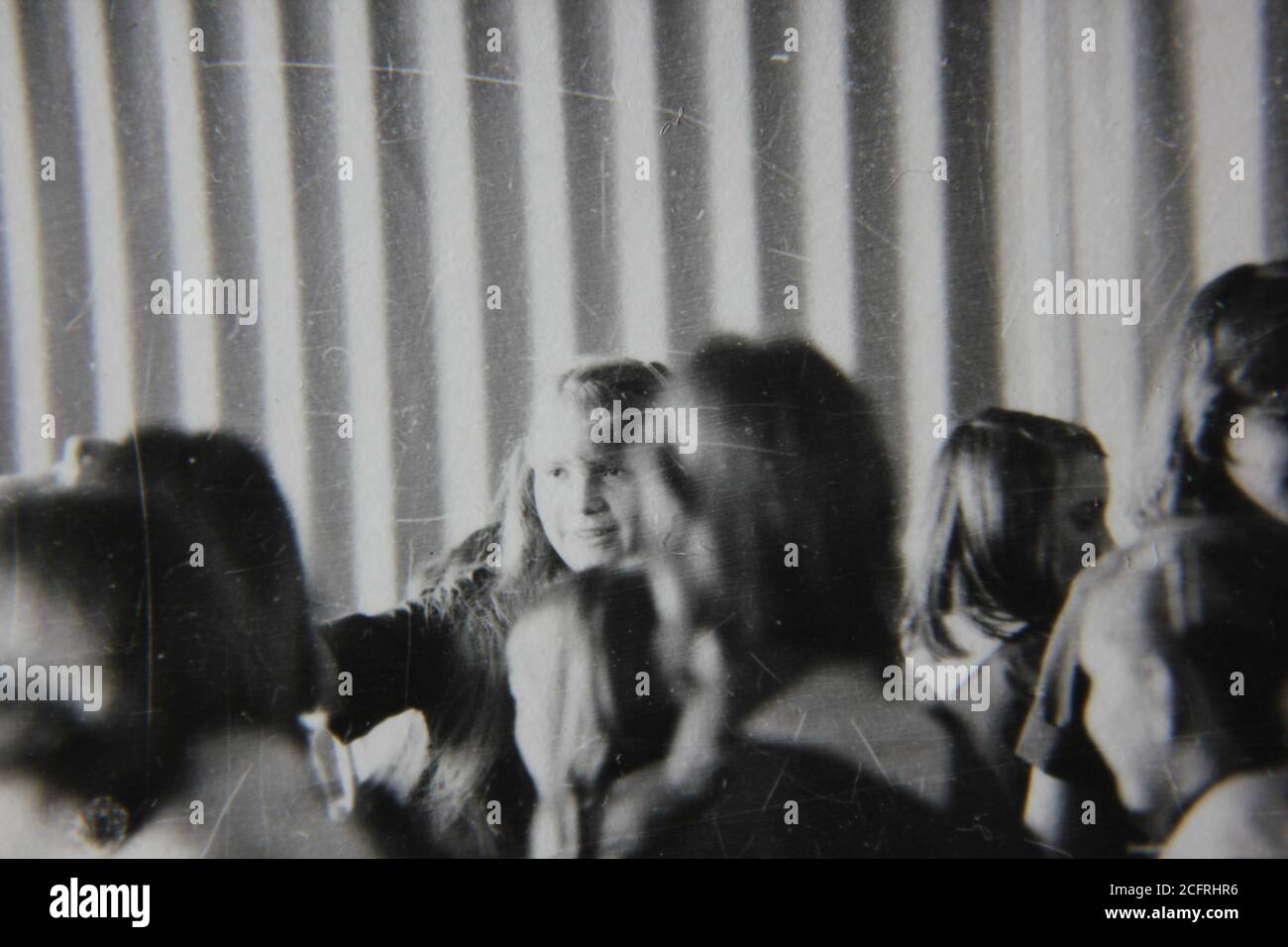 Fine 1970s vintage black and white photography of crowd of young girl scouts mingling about. Stock Photo