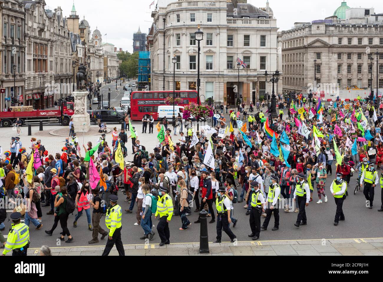 Crowd marching through Trafalgar Square, 'Carnival of Corruption' Extinction Rebellion demonstration, London, 3 September 2020 Stock Photo
