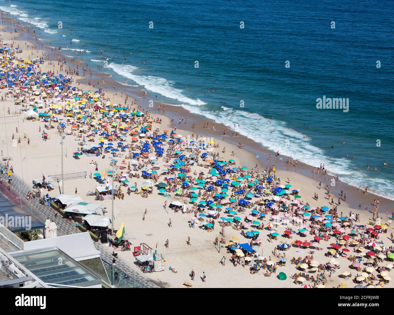 Leblon Beach, Rio De Janeiro, Brazil, 2019.  Locals and Holidaymakers enjoying a relaxing day on the beach.  It is one of the city’s trendiest, most t Stock Photo