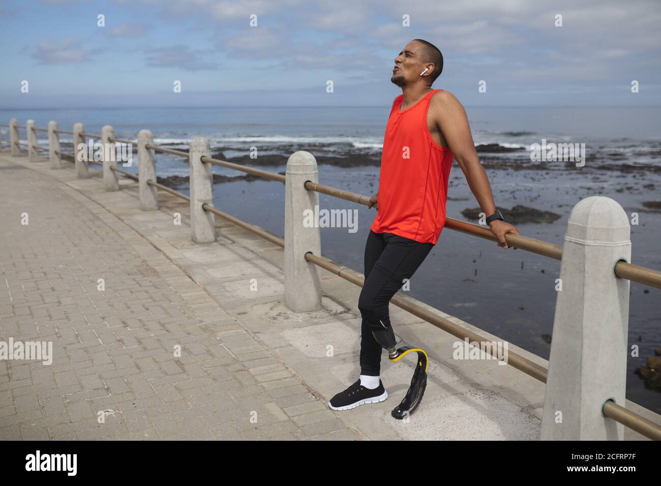 Man with prosthetic leg standing on the promenade Stock Photo