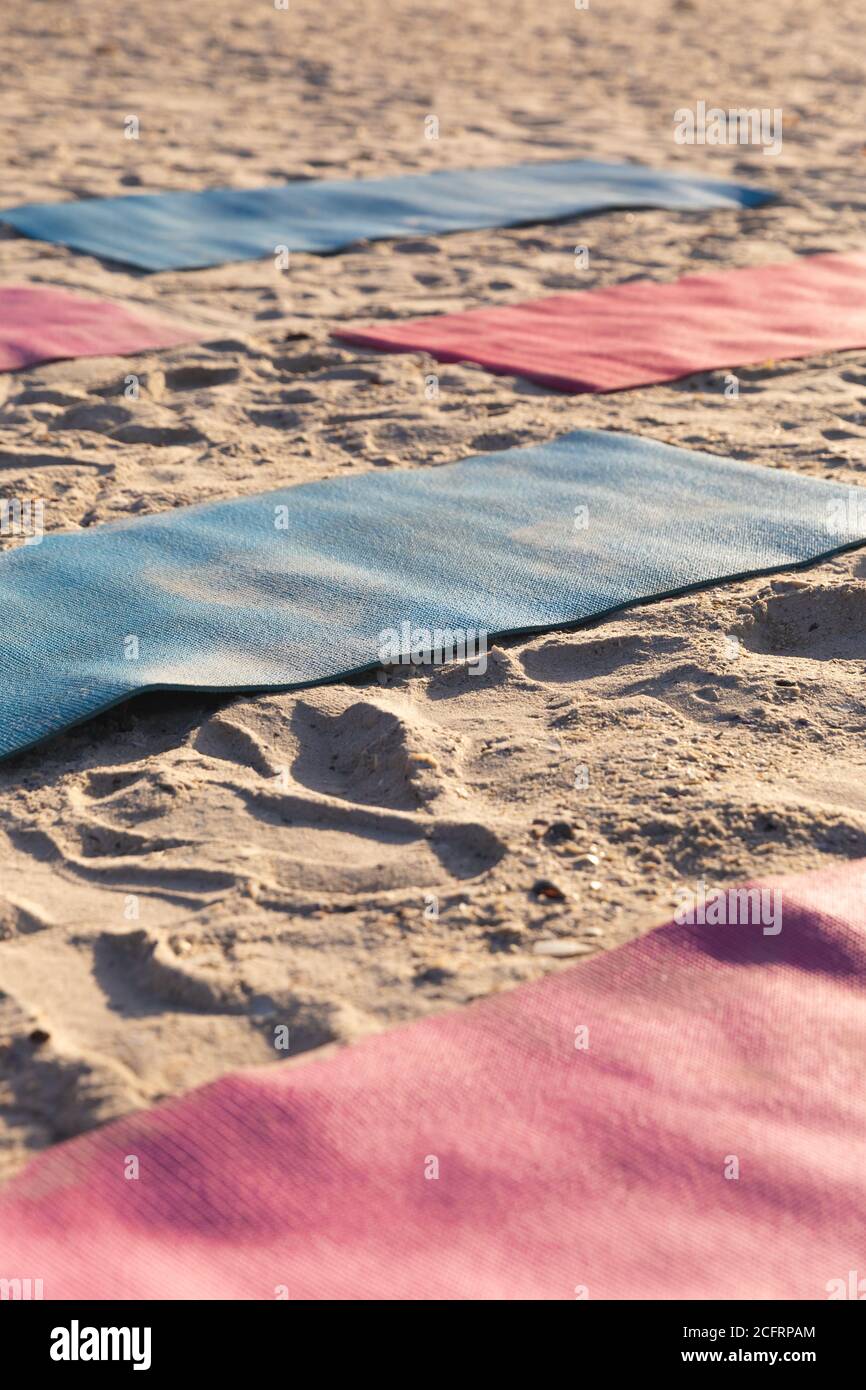 Multiple yoga mats on the beach Stock Photo Alamy