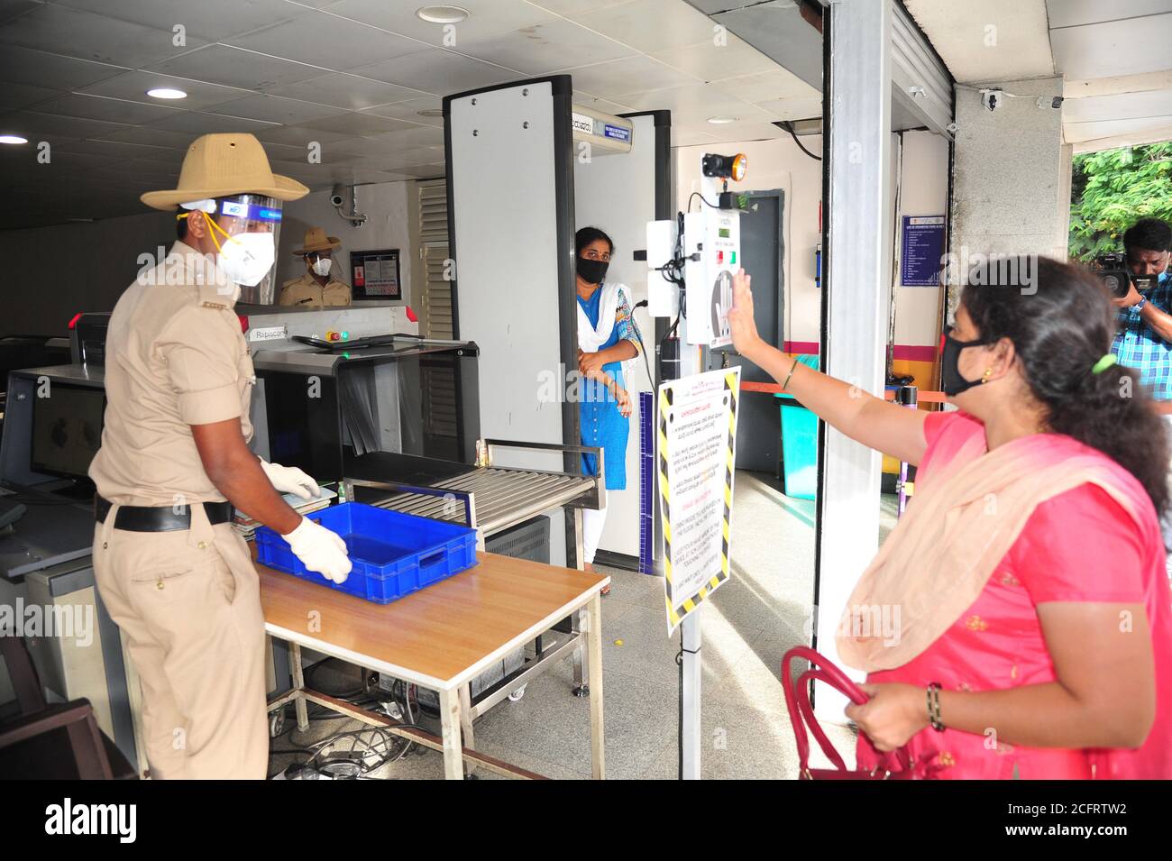 Bangalore, India. 7th Sep, 2020. Indian commuters undergo hands free thermal screening at a metro train station in Bangalore, India, Sept. 7, 2020. Metro rail services resumed Monday morning in different cities across India after a gap of over five months, officials said. Credit: Str/Xinhua/Alamy Live News Stock Photo
