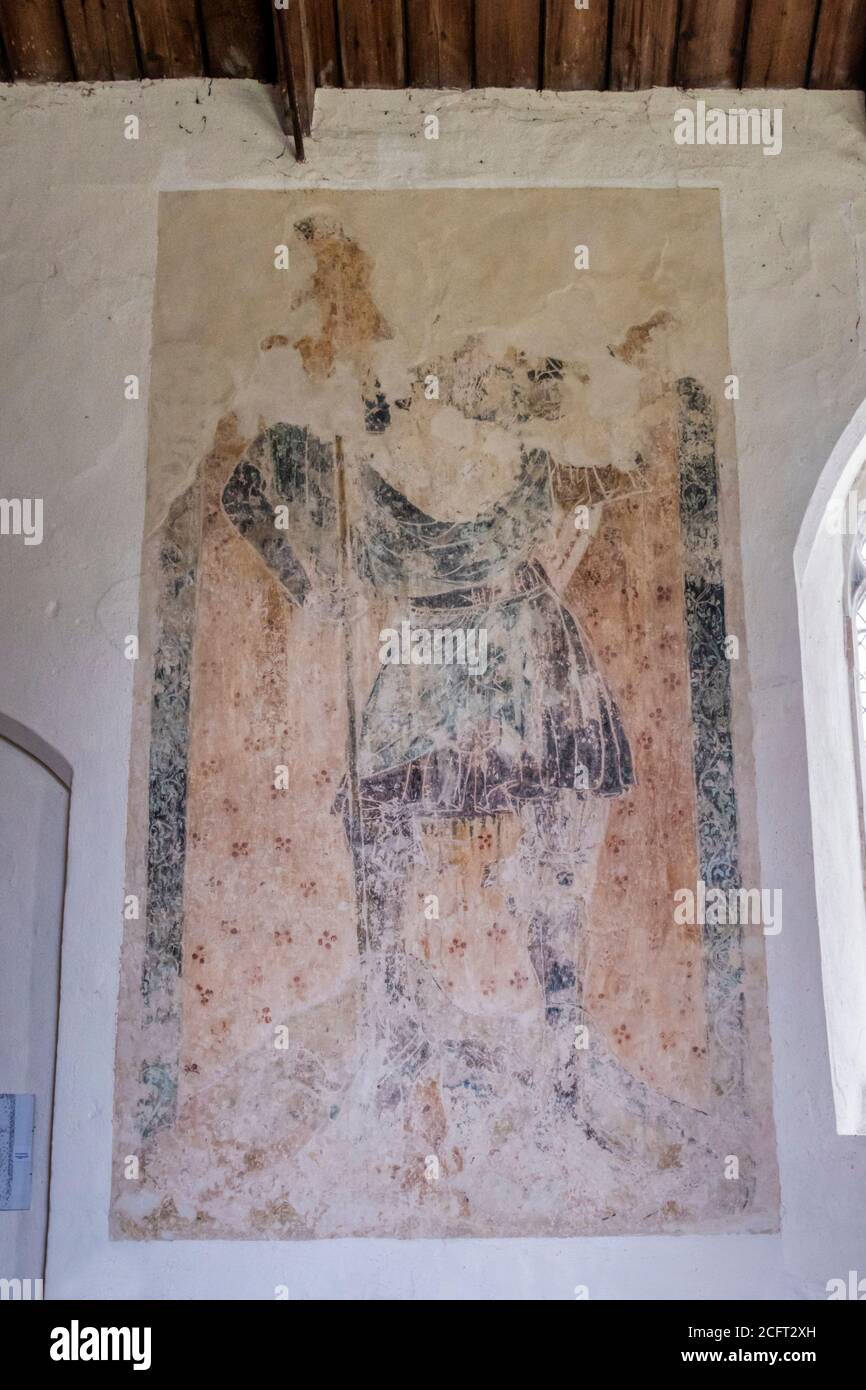 Early 14th century painting of St Christopher in the nave of All Saints church, Fring in Norfolk. Stock Photo