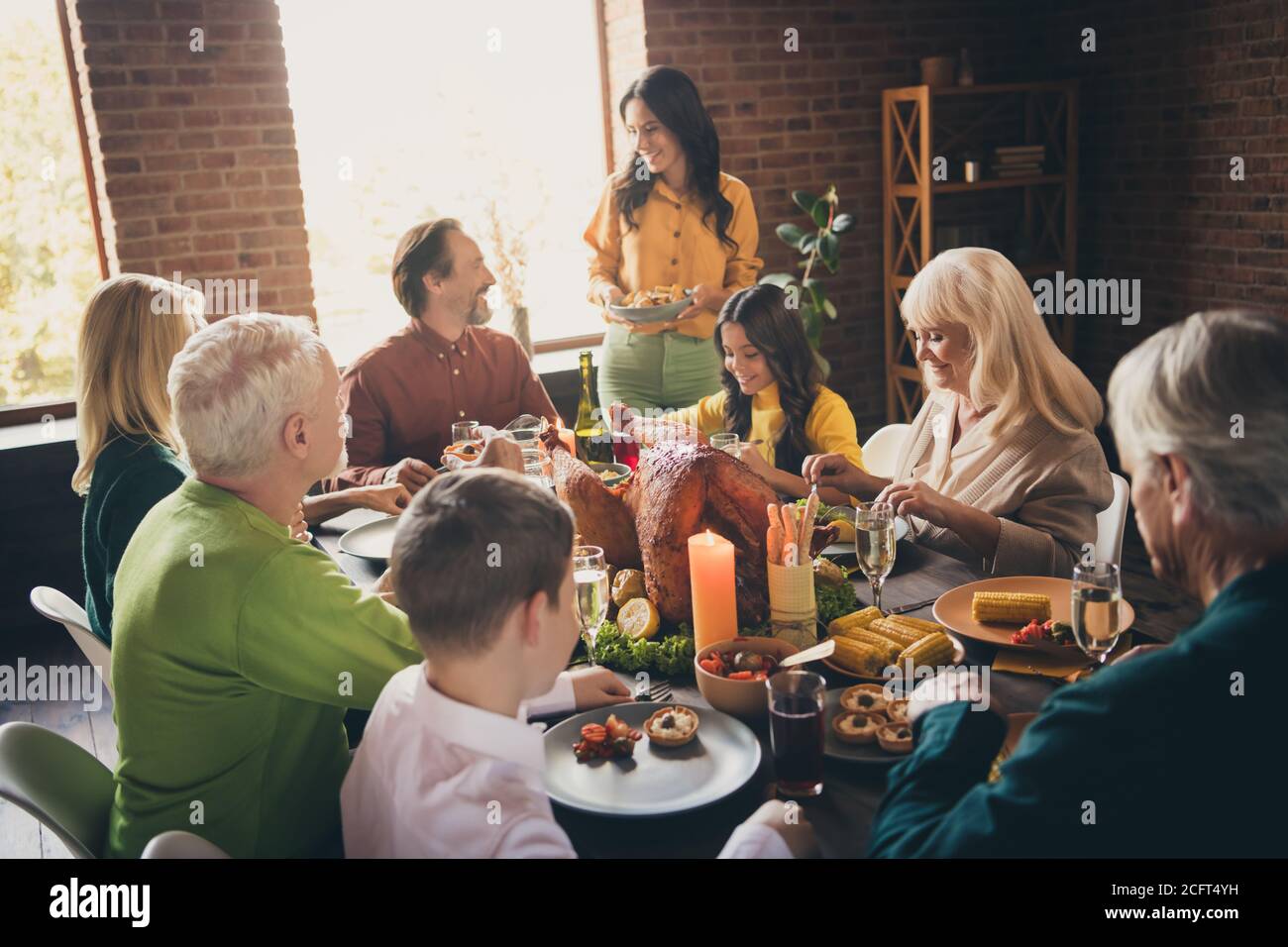 Portrait of nice attractive cheerful family parents grandparents generation sitting around