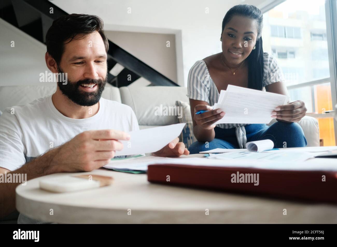 Couple Checking Bills for Home Budget and Tax Stock Photo