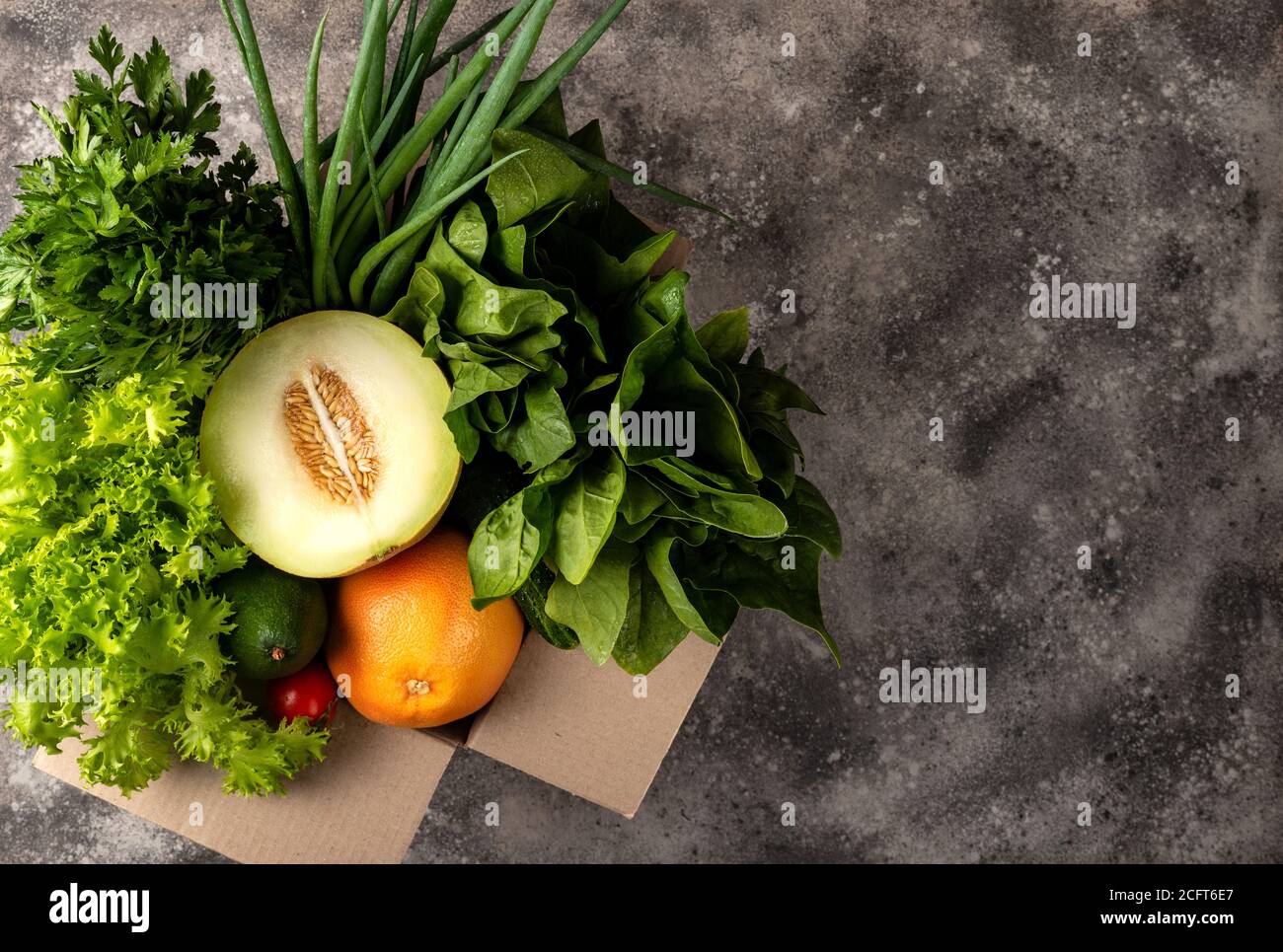 Different organic fresh vegetables in box. Order and delivery food