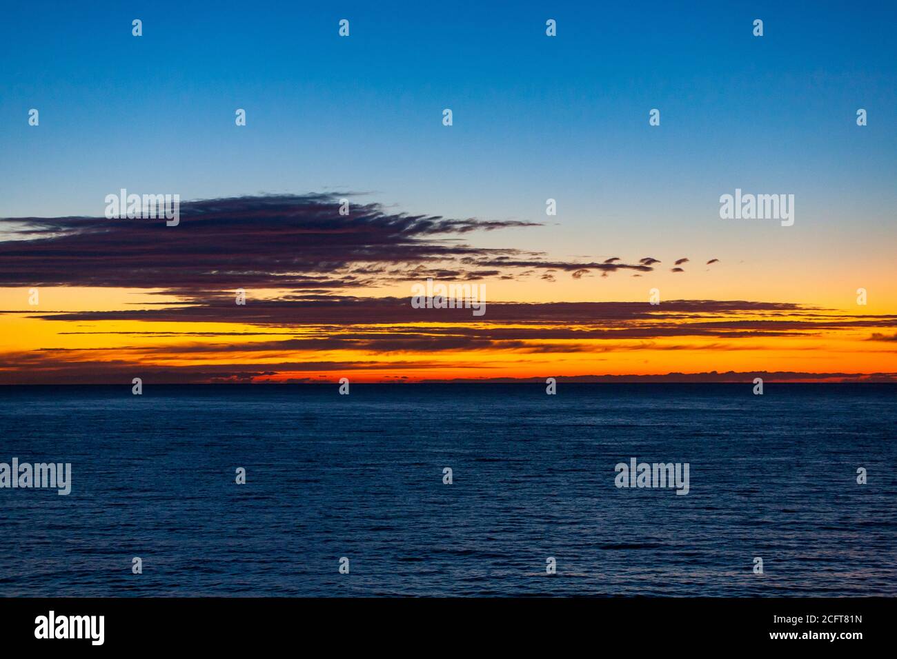 sunrise over the ocean, blue hour just before sunrise, daybreak Stock