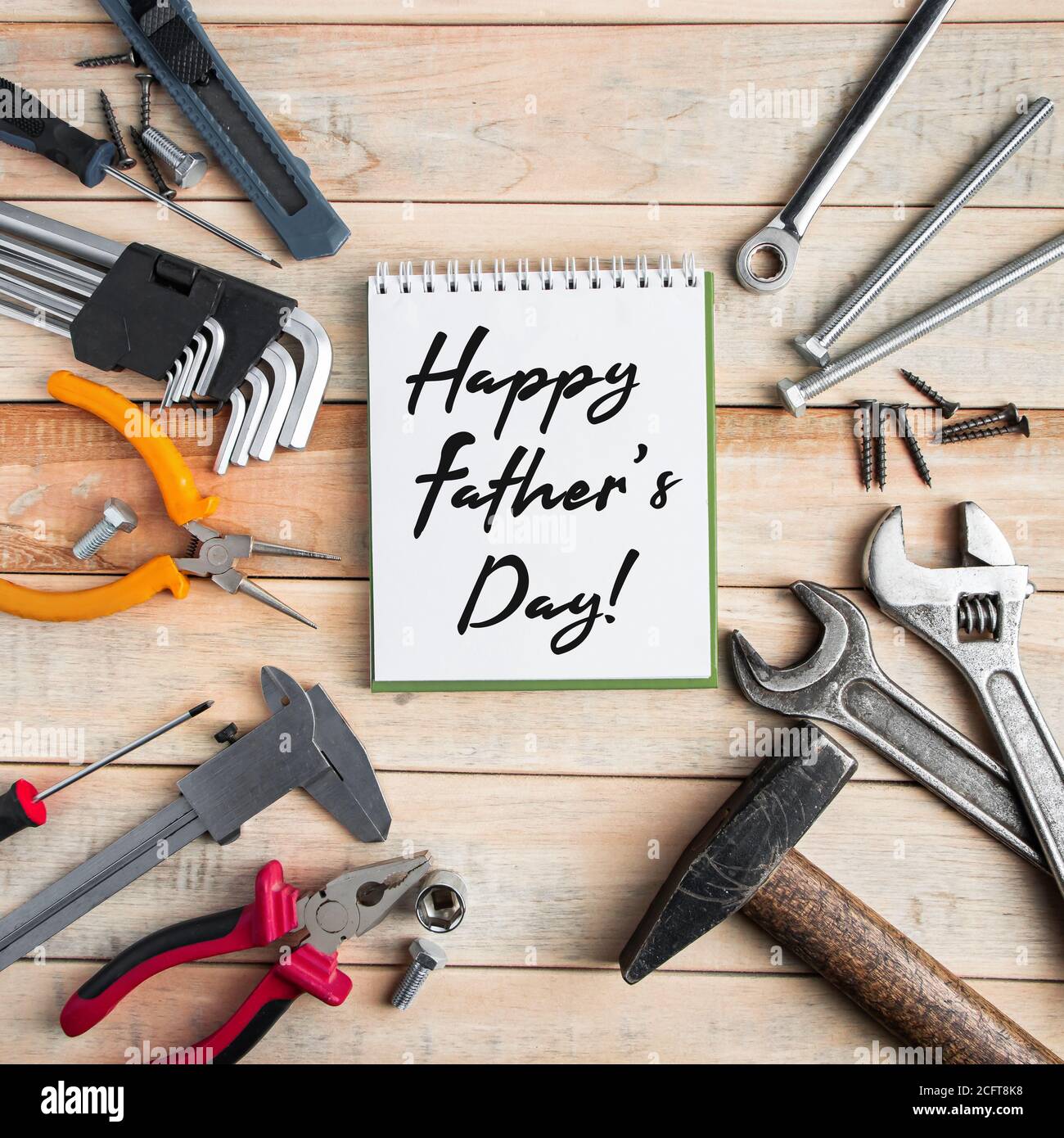 International Father's Day. Greeting card concept. Set of construction  tools on a wooden background. Place for text Stock Photo - Alamy