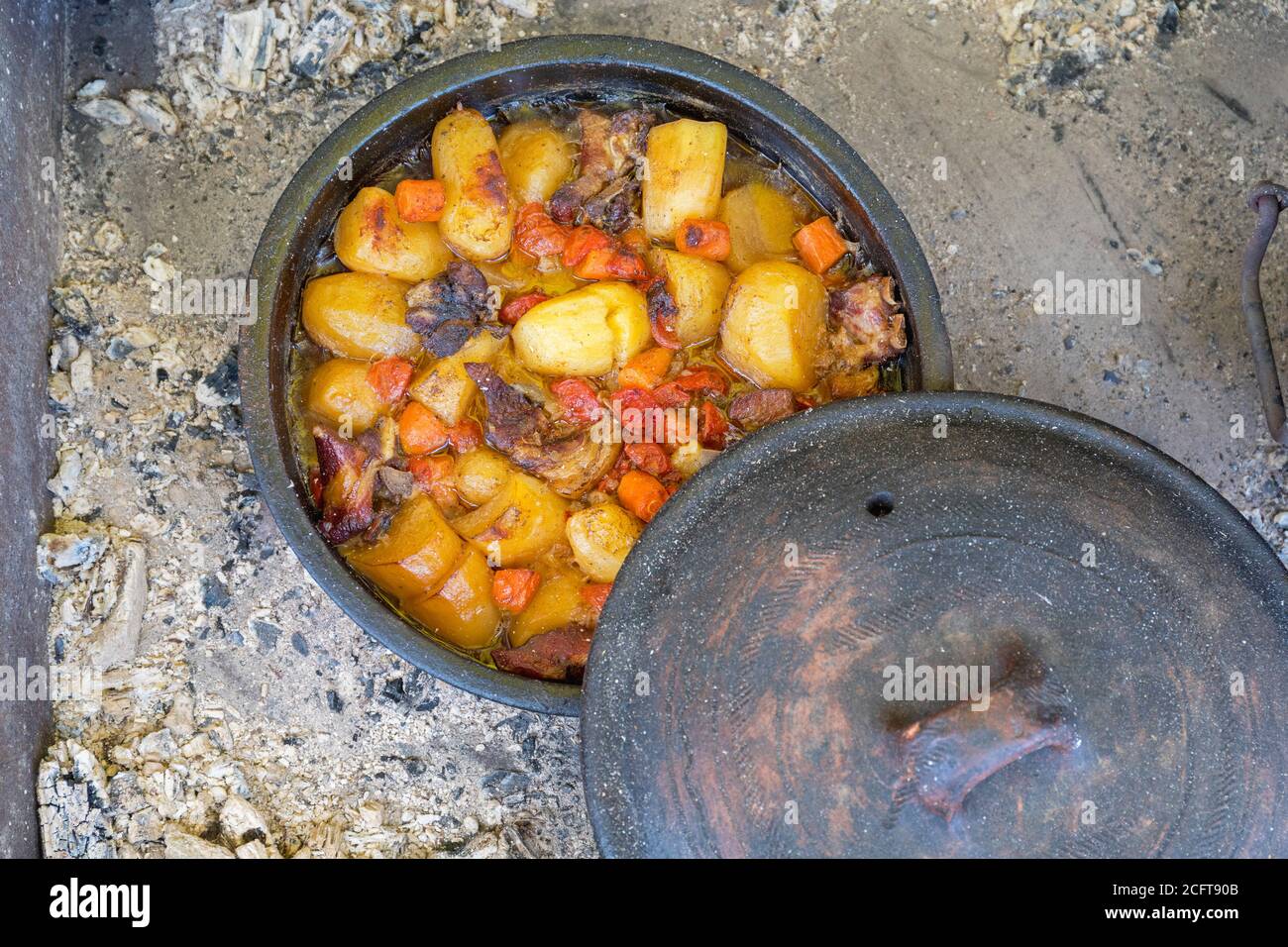 Slow Cooking in Dutch Oven at Coals Fire Stock Photo Alamy