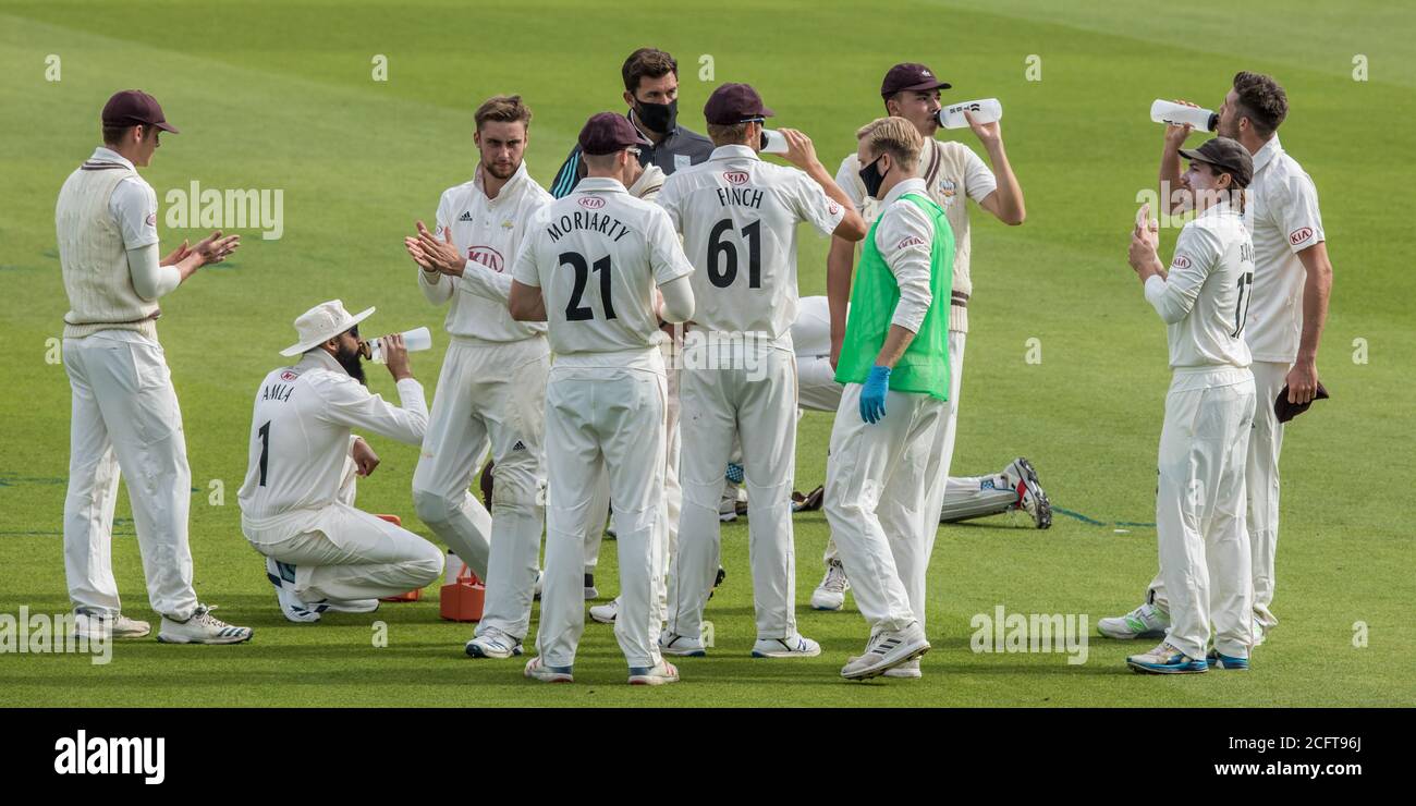 London, UK. 7 September 2020. The Surrey team during a drinks break as they take on Sussex on day two of the Bob Willis Trophy game at the Oval. David Rowe/Alamy Live News Stock Photo