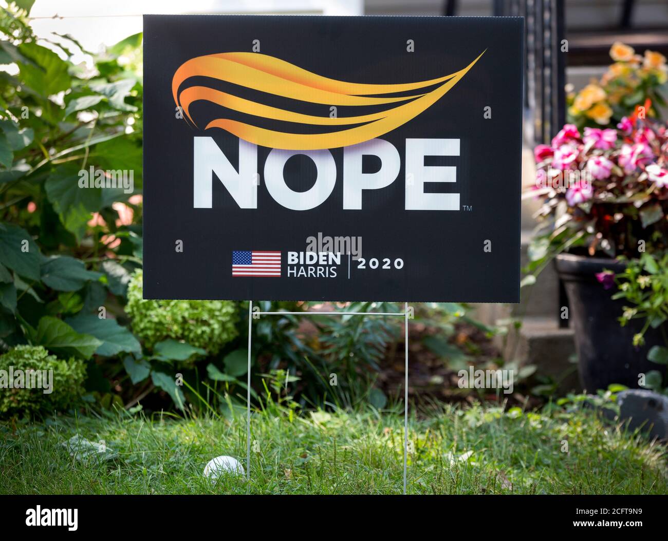 A 2020 Joe Biden and Kamala Harris anti-Donald Trump presidential yard sign with a design of an orange hair style and the word Nope. Stock Photo