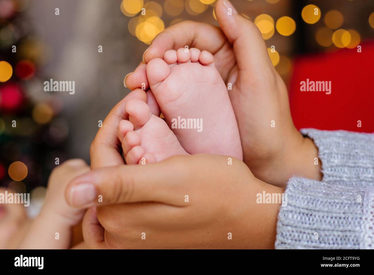 Mom keeps baby legs with pens Stock Photo Alamy