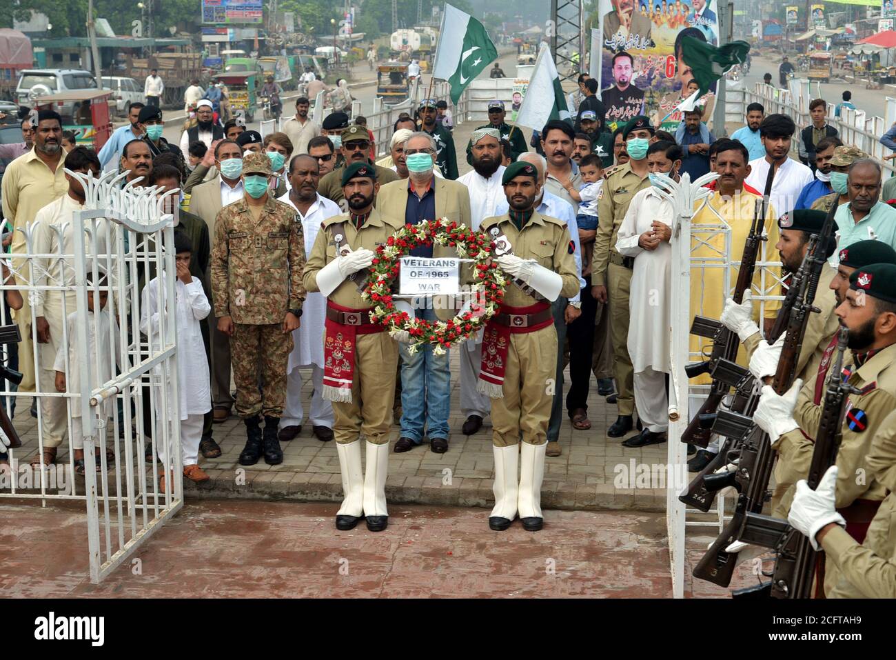 Punjab Rangers and soldiers in black uniform take a part of flag-lowering ceremony on the eve of Defense and Martyrs Day at the Joint Check Post (JCP) Wagah border in Lahore. Since the Partition of British India in 1947, Pakistan and India remained in contention over several issues. Although the Kashmir conflict was the predominant issue dividing the nations, other border disputes also existed, most notably over the Rann of Kutch, a barren region in the Indian state of Gujarat. The issue first arose in 1956 which ended with India regaining control over the disputed area. (Photo by Rana Sajid Stock Photo