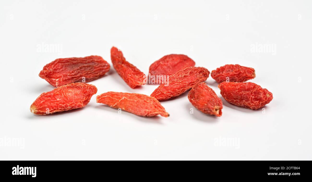 Closeup photo of goji berry wolfberry - Lycium chinense dried fruits isolated on white background Stock Photo