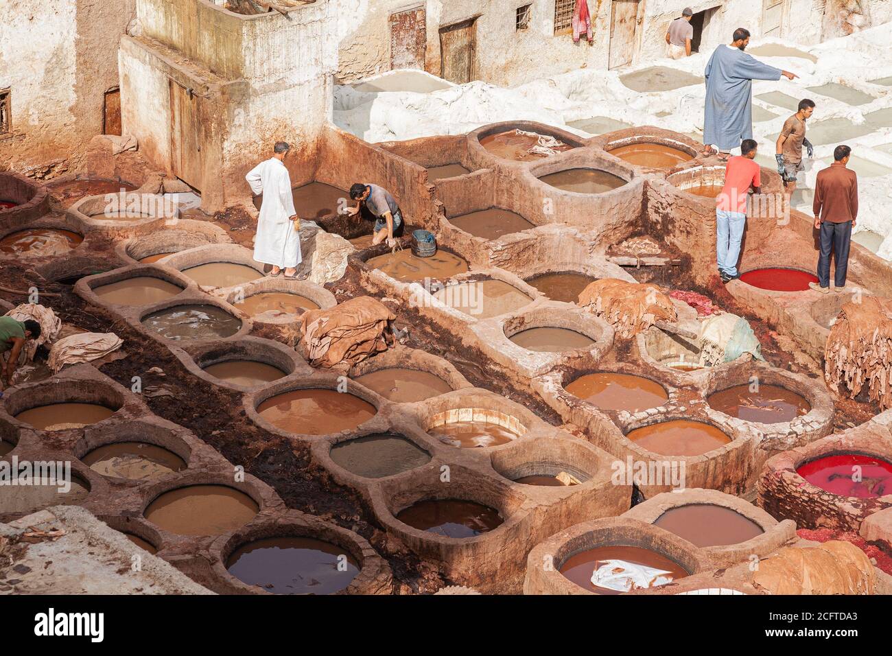 Men working in the tanneries, Fez, Morocco Stock Photo