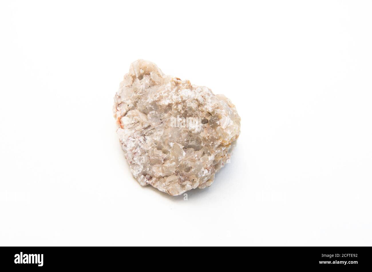 Alaskite Rqd detail of alaskite isolated over white background Stock Photo - Alamy