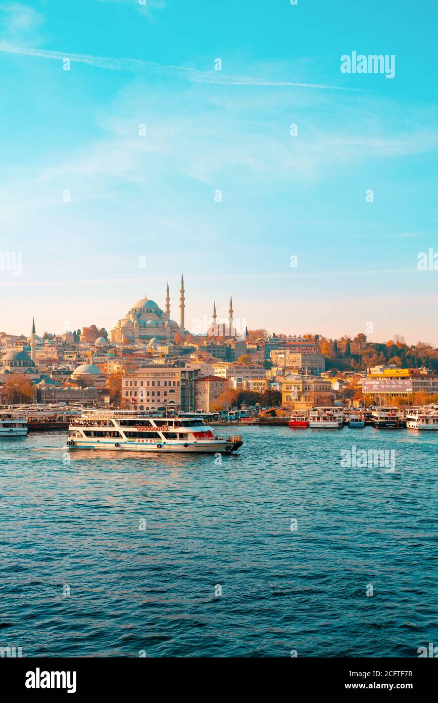 23.10.2019 Istanbul, Turkey. Cruise pleasure ship sails on the sea. In the background there is a horizon and a view of the city. Vertical. Copy space. Stock Photo