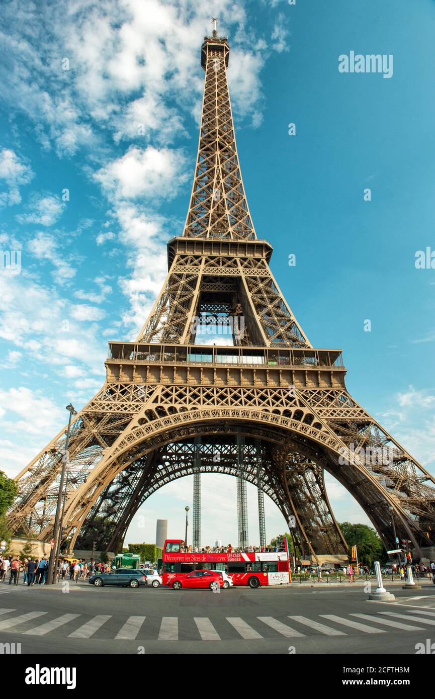 Eiffel Tower (La Tour Eiffel) in Paris over cloudy blue sky Stock Photo