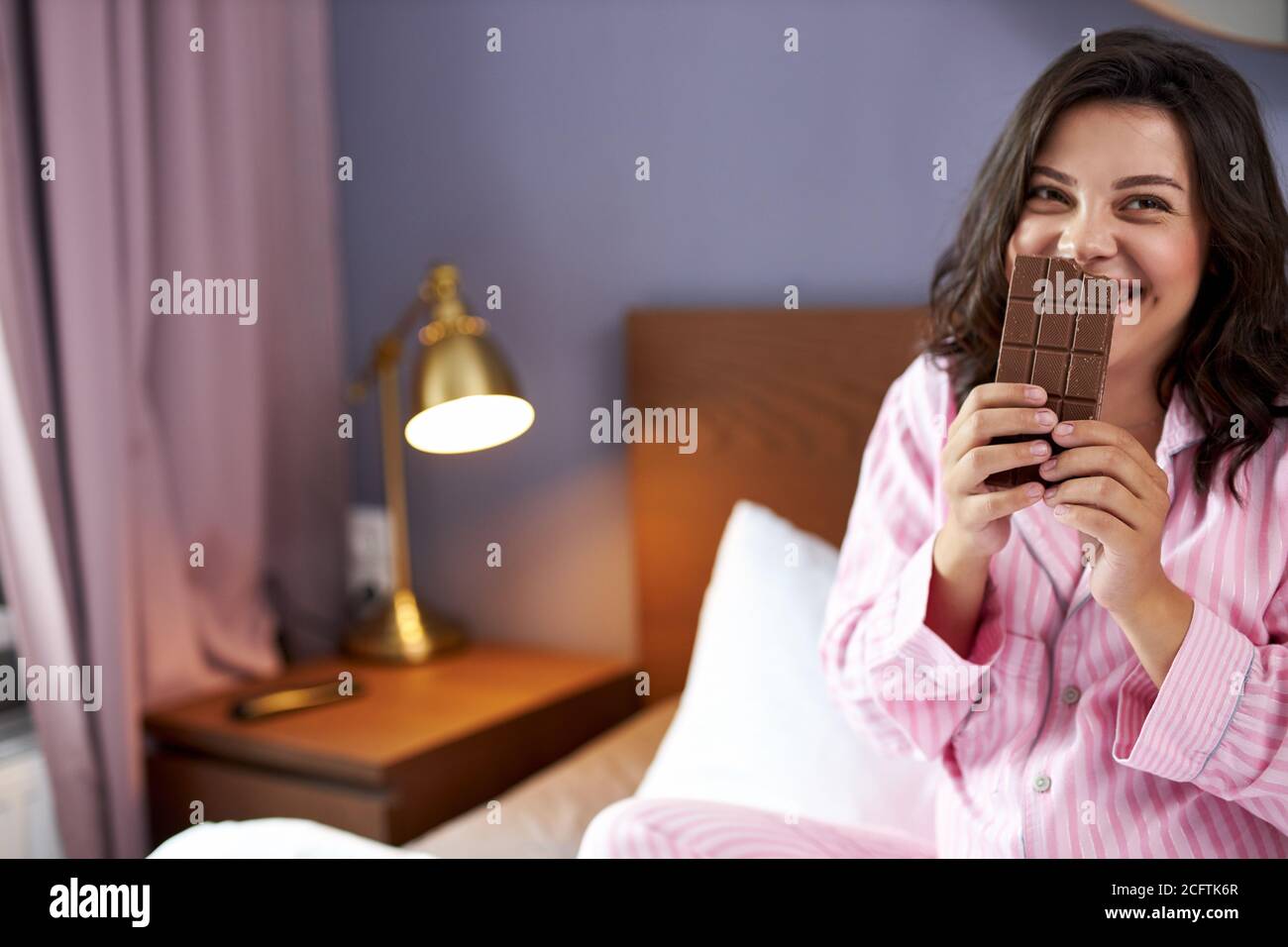 sweet craving during pregnancy concept, pregnant woman with chocolate