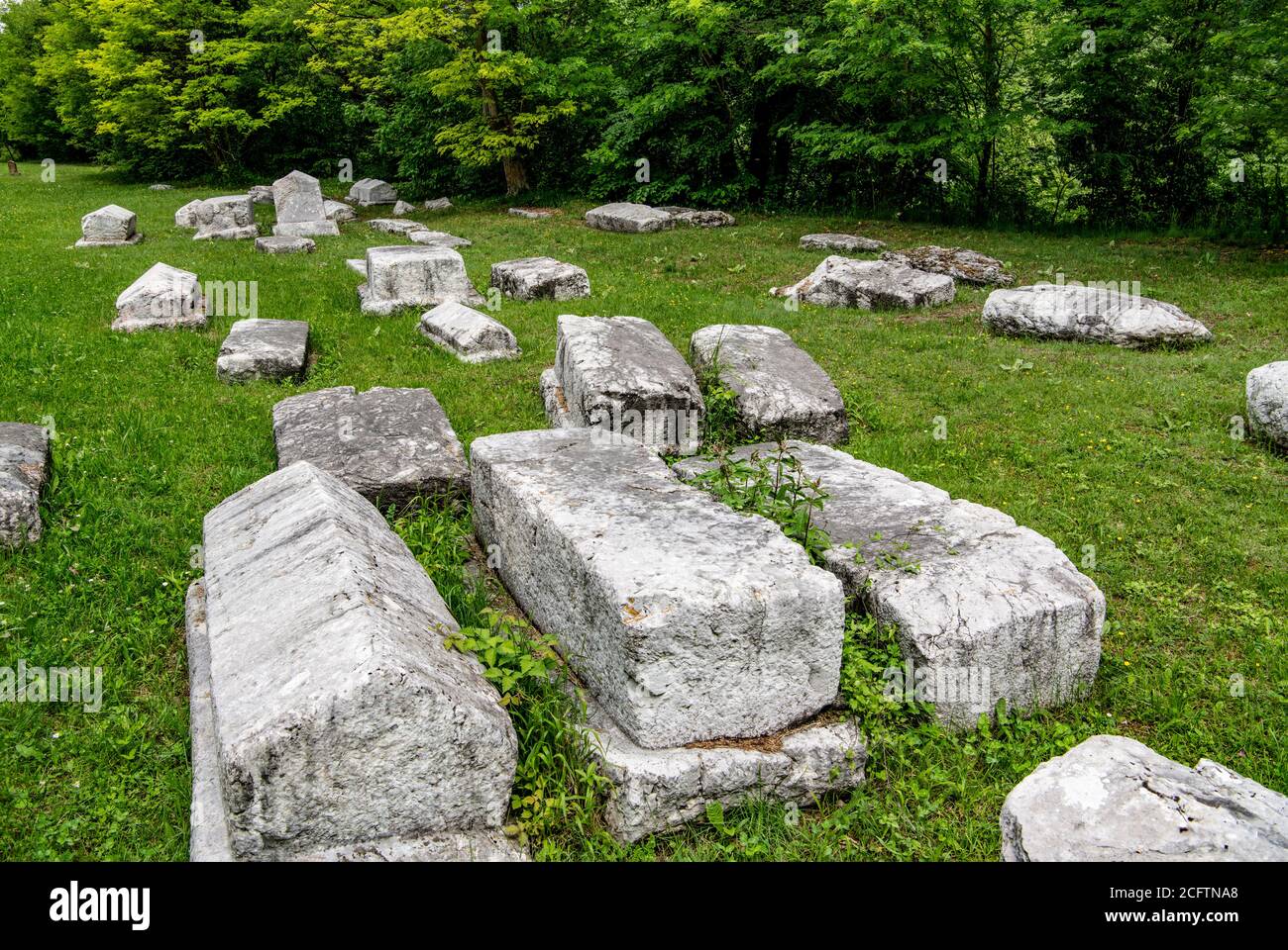 Medieval necropolis from 14th century called Mramorje. Located in Perucac national park Tara mountain, Serbia. Tombstones of different shapes. Stock Photo