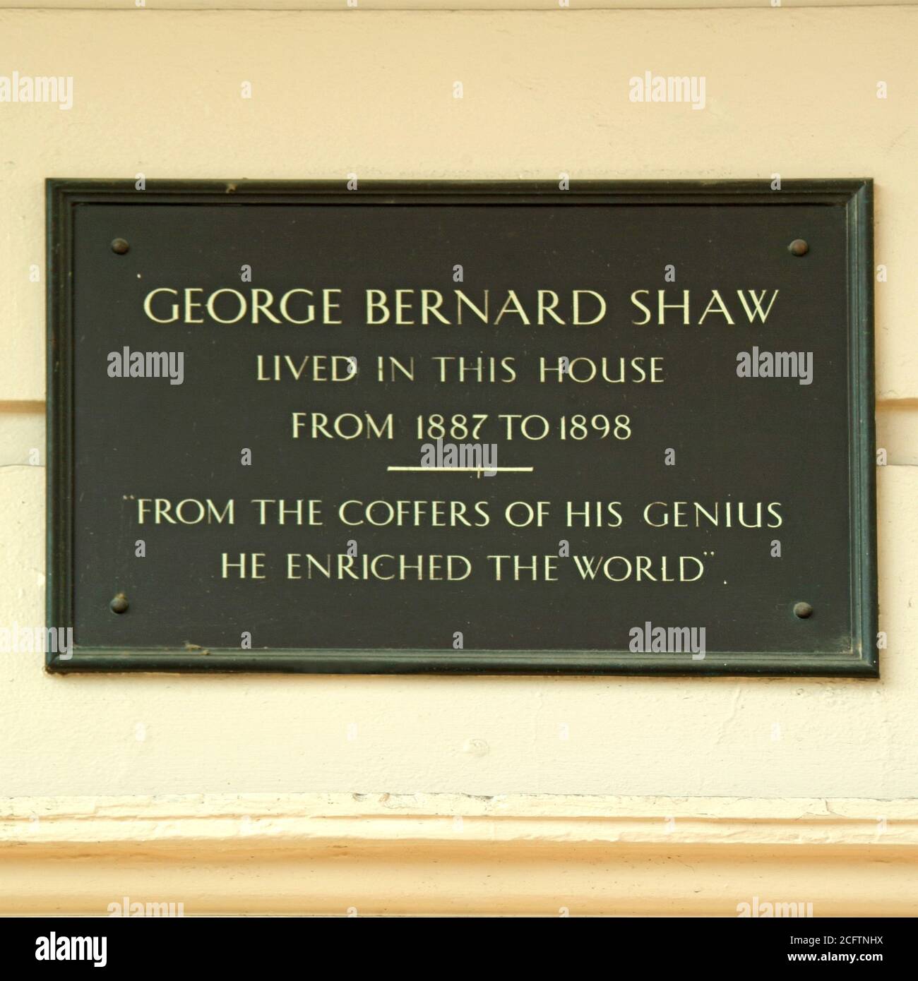 Historical information plaque on a Robert Adams building in Fitzroy Square recording occupied by George Bernard Shaw 1887 to 1898 London England UK Stock Photo