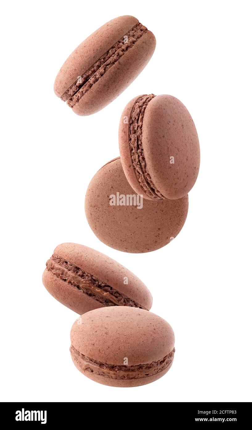 Isolated macaroons. Five chocolate macaroons falling down over white background Stock Photo