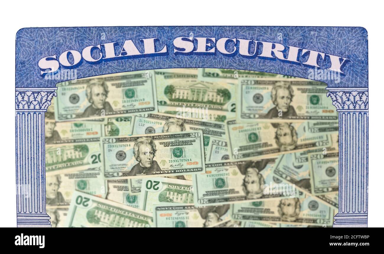 Concept of social security and retirement funding issues in USA with many US dollars laid out in inside the framework of a social security card Stock Photo