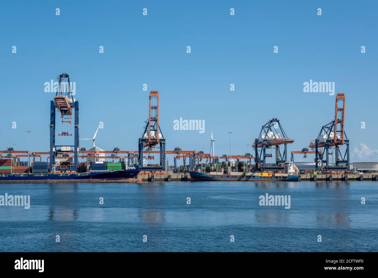 Container ships moored at a container terminal in the Port of Rotterdam ...