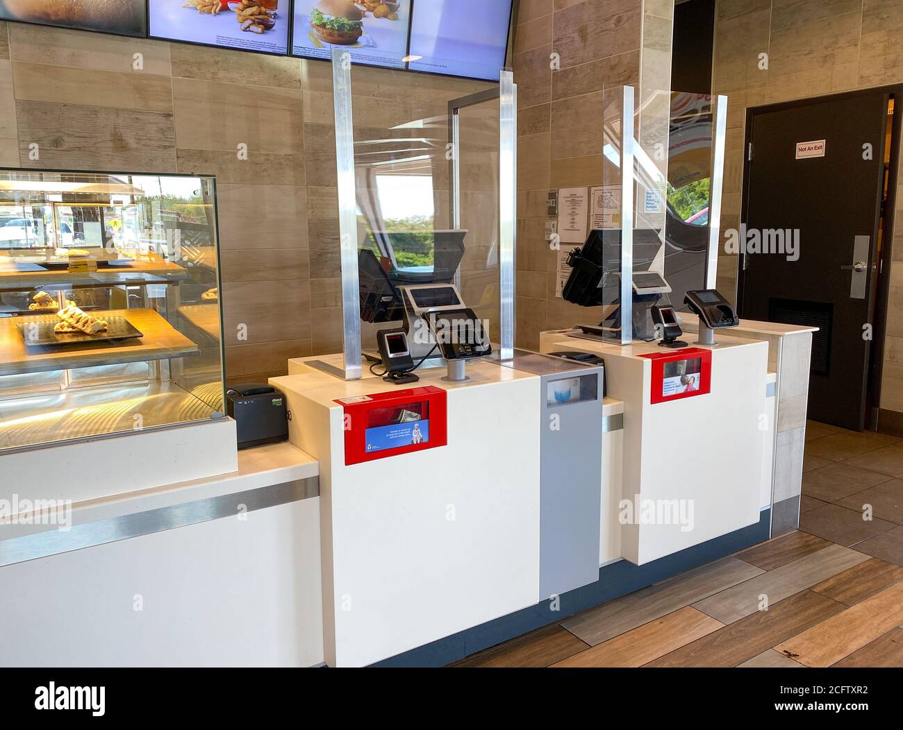Orlando, FL/USA-9/1/20: The order and payment counter with plexiglass shields for the the coronavirus pandemic at a McDonalds in Orlando, Florida. Stock Photo