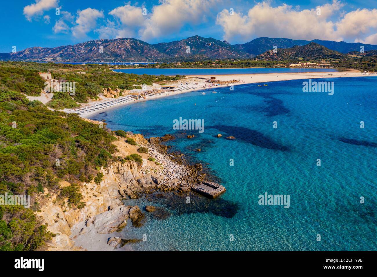 Panoramic view of sandy beach, yachts and sea with azure water, in