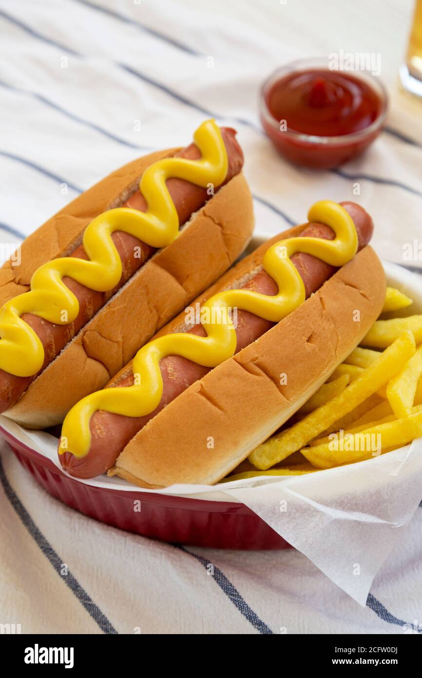 Homemade Mustard Hot Dog with French Fries, side view. Stock Photo