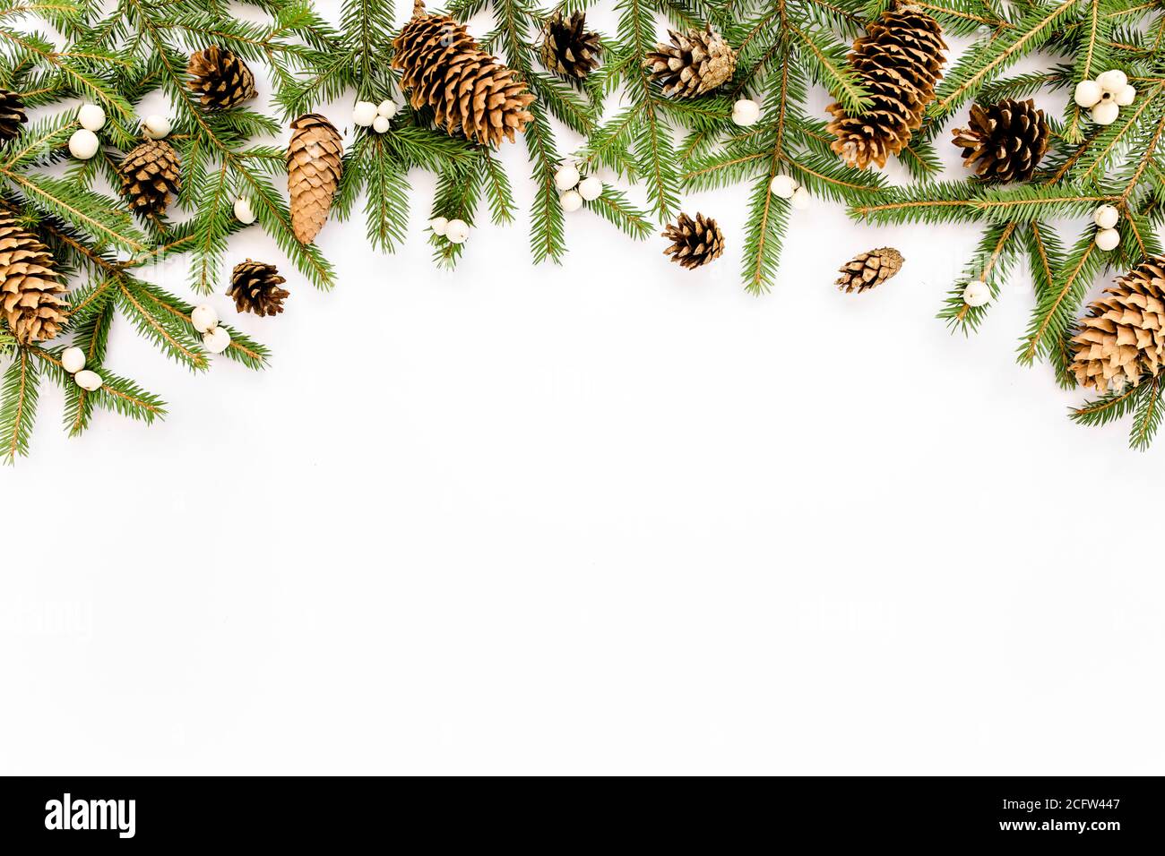 Christmas composition with fir branches, pine cones on white background ...