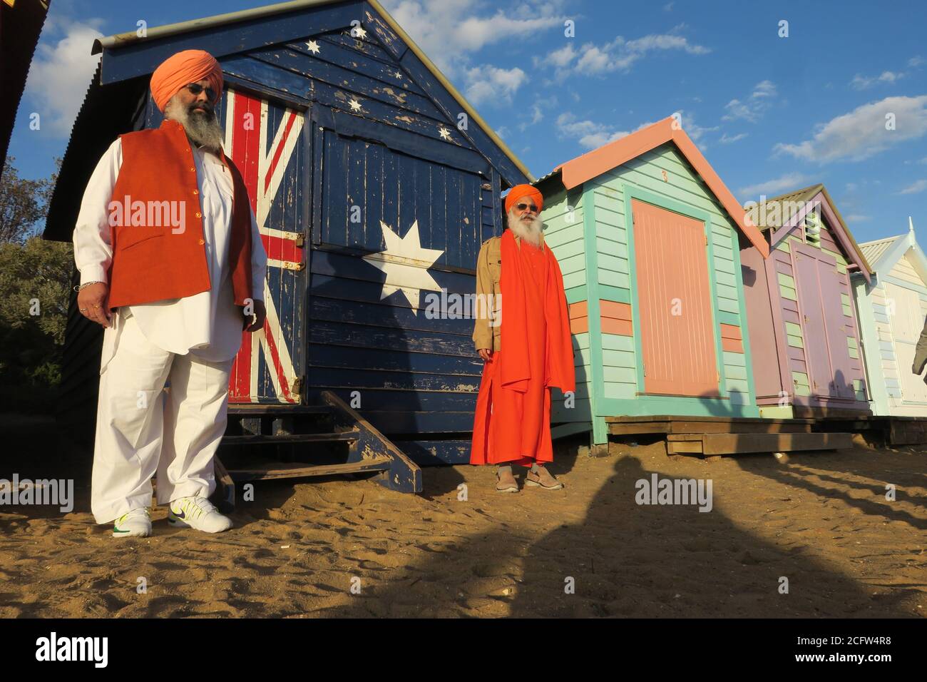 Melbourne Australia. Scenes of daily life in Melbourne Australia . Two Indian Sikhs at the Brighton beach boxes.. Stock Photo