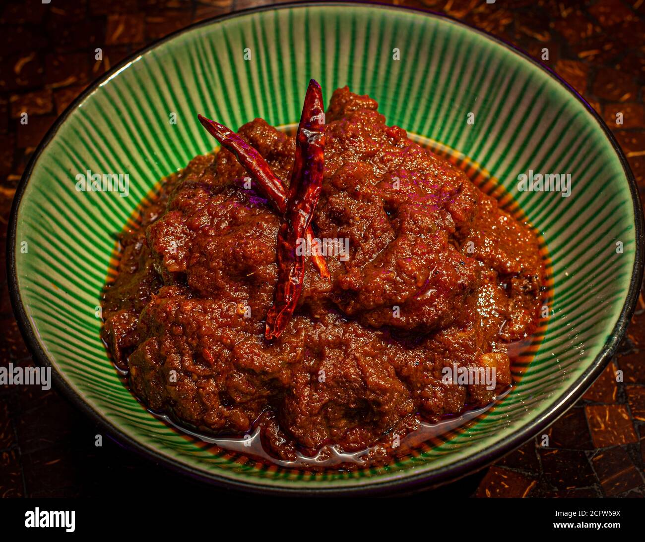 You can already see the spiciness of the Beef Masaman. Therefore, it should be enjoyed as the last main course of Kitchen-Chef Jimmy Shu of Hanuman in Darwin, Northern Territory, Australia Stock Photo