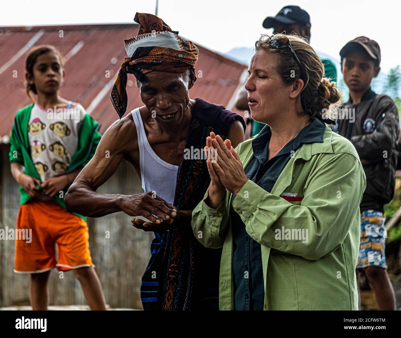A translator ensures communication with the locals in an Indonesian village Stock Photo