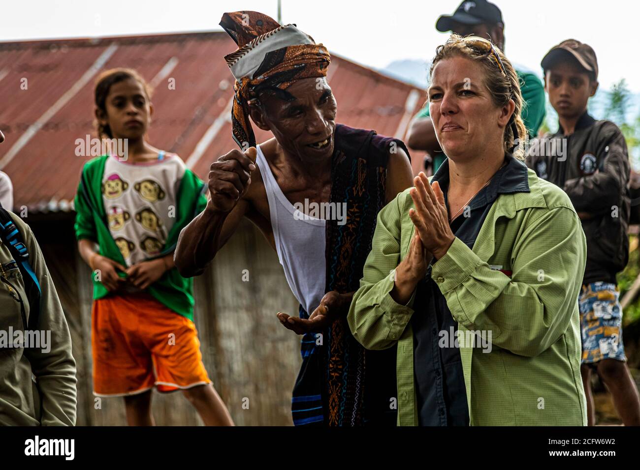 A translator ensures communication with the locals in an Indonesian village Stock Photo