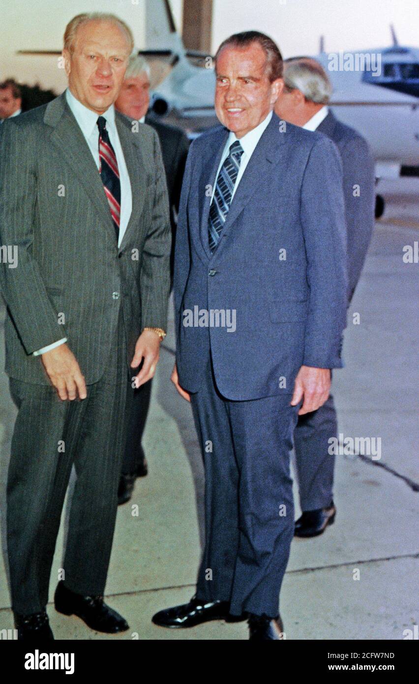 Former Presidents Gerald Ford (left) and Richard Nixon chat for a moment as they prepare to depart for Egypt.  They will attend the funeral for slain Egyptian President Anwar Sadat. Stock Photo