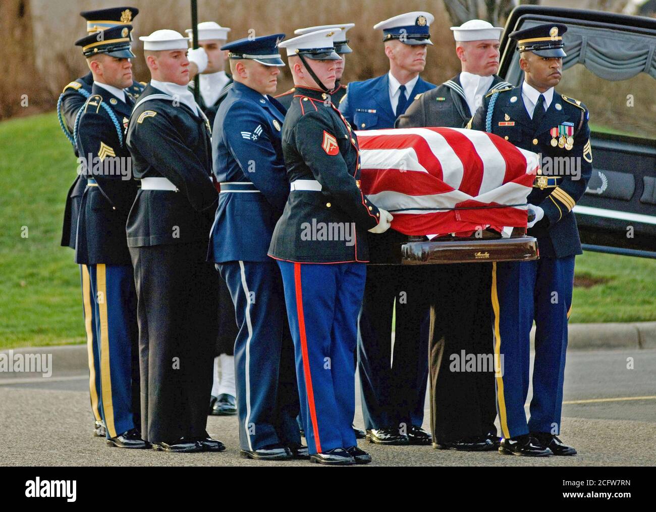 The Joint Department of Defense Honor Guard carries Former President Gerald R. Ford into the Gerald R. Ford Presidential Museum during his funeral service. Stock Photo