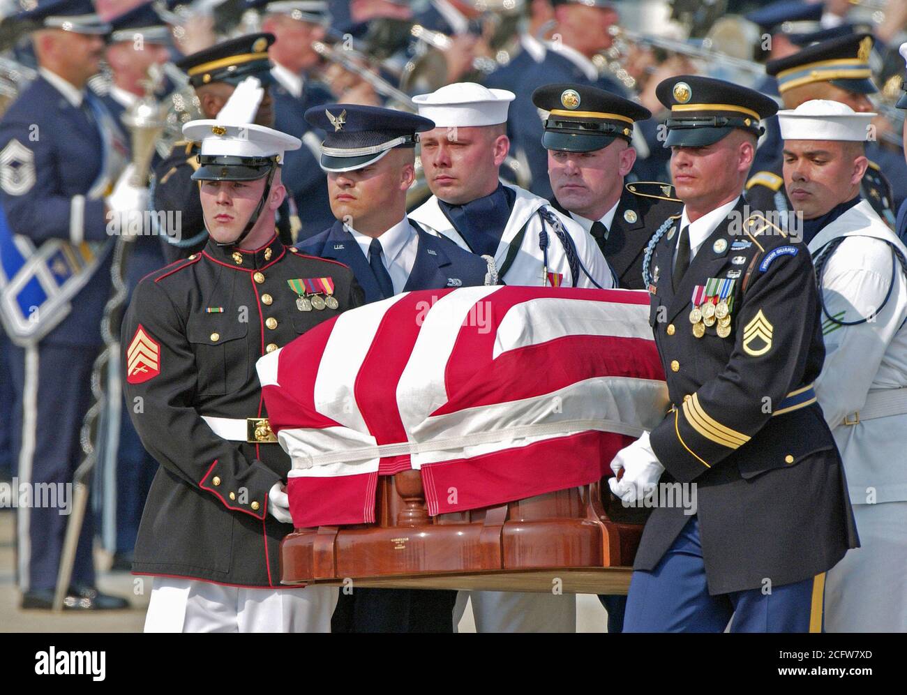 A combined US Military honor guard carries the 40th President of the ...