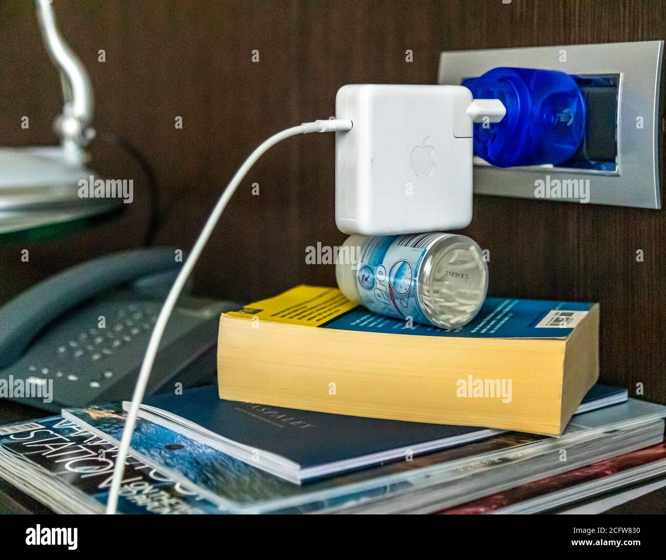 Adventurous constructions are sometimes necessary because the Australian type I sockets cannot support the weight of heavy adapters. Power Adapter in Darwin, Australia Stock Photo