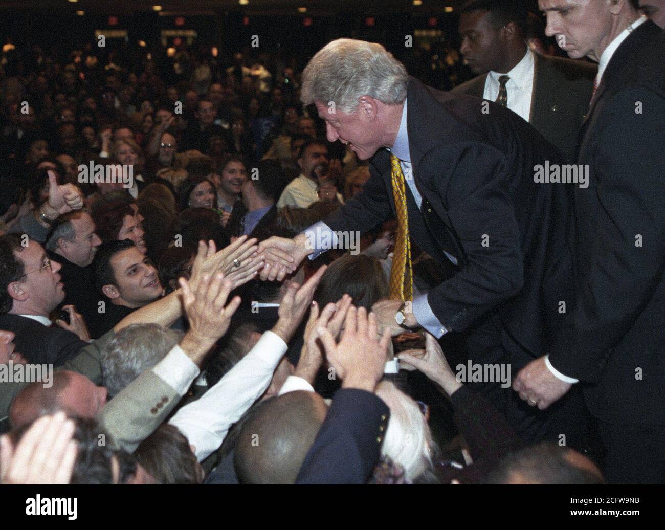 Photograph of President William Jefferson Clinton Shaking Hands on Stage at a 'Hillary Rodham Clinton for Senate' Event in Hempstead, New York 10/22/2000 Stock Photo